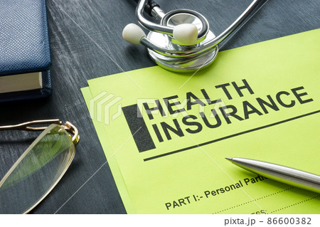 Health insurance form with stethoscope on the wooden surface. 86600382