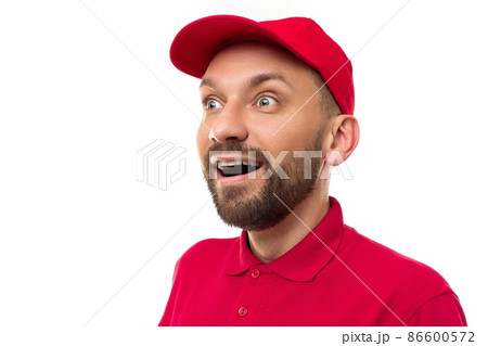 close-up portrait of a delivery courier wearing a red uniform close-up portrait of a delivery courier wearing a red uniform 86600572
