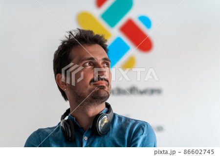 Formal business male portrait. A confident successful casual businessman or manager stands in front of a white background. Formal business male portrait. A confident successful casual businessman or manager stands in front of a white background. 86602745
