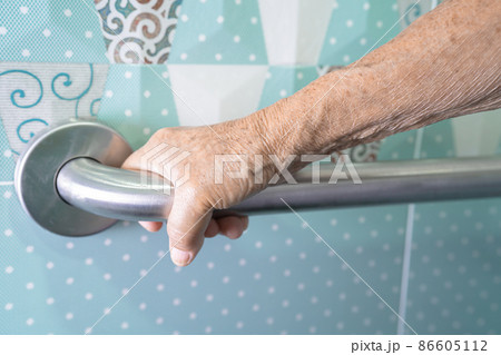 Asian senior or elderly old lady woman patient use toilet bathroom handle security in nursing hospital ward, healthy strong medical concept. Asian senior or elderly old lady woman patient use toilet bathroom handle security in nursing hospital ward, healthy strong medical concept. 86605112