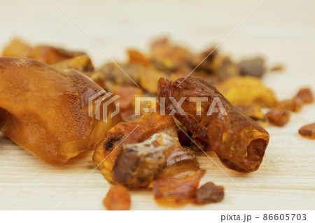 Amber. There are many different transparent pieces of amber, small and large, Ancient wood resin as a mineral for jewelers. The Sunstone 86605703