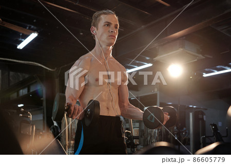 Man Working on His Biceps Man Working on His Biceps 86605779