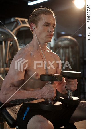 Man Exercising with Heavy Dumbbells Man Exercising with Heavy Dumbbells 86605780