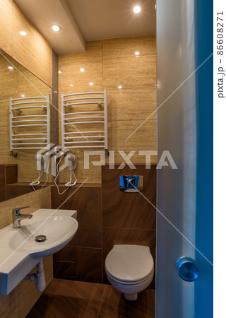 White washbasin with mirror toilet bowl dryer in the combined bathroom White washbasin with mirror toilet bowl dryer in the combined bathroom 86608271