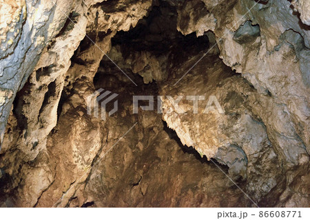 entrance to the cave in the rock in Slovakia 86608771