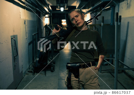 Tough Female Soldier with Big Gun 86617037