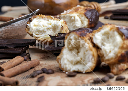 custard cake with cream, chocolate and other sweets custard cake with cream, chocolate and other sweets 86622306
