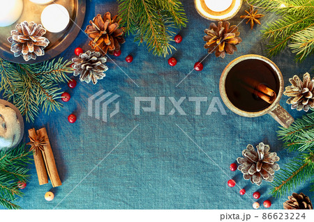 Cup of hot drink on christmas background. Cozy evening, mug of mulled wine, xmas Cup of hot drink on christmas background. Cozy evening, mug of mulled wine, xmas 86623224
