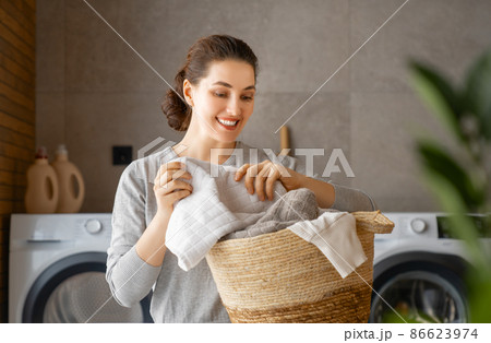 woman is doing laundry 86623974