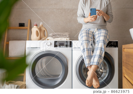 woman is doing laundry 86623975