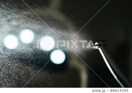 Close the dental turbine with a water spray. Dentist equipment. 86624295
