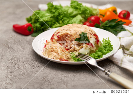 Delicious chicken aspic on a plate on concrete table 86625534