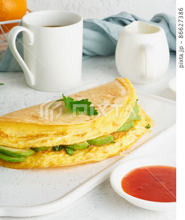 Trendy breakfast with quesadilla and eggs, trending food with omelet, cheese Trendy breakfast with quesadilla and eggs, trending food with omelet, cheese 86627386