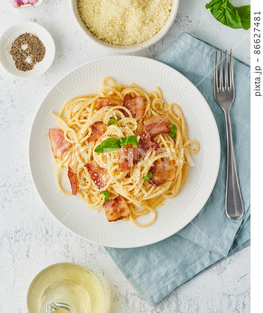 Carbonara pasta. Spaghetti with pancetta, egg, parmesan cheese and cream sauce Carbonara pasta. Spaghetti with pancetta, egg, parmesan cheese and cream sauce 86627481
