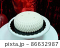 White mousse cake. Small white wedding cake on a red background 86632987