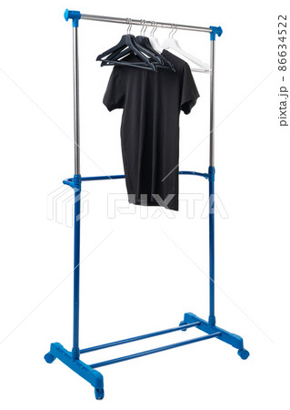 Black T-shirt on hangers on metal rack isolated on white background 86634522