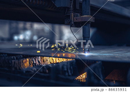 Close up Fiber laser cutting CNC machine cuts metal list. Making metal part. Workshop in factory 86635931