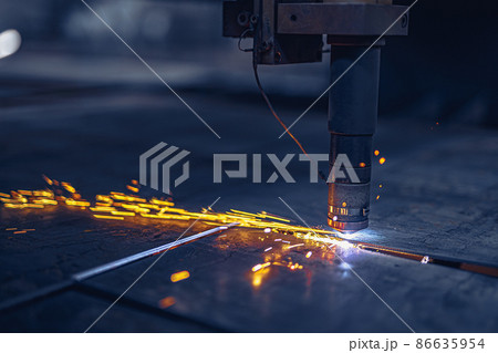 Fiber laser cutting CNC machine cuts metal list. Making metal part. Workshop in factory 86635954