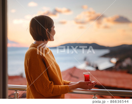 Woman drinking turkish tea from traditional turkish teacup 86636544