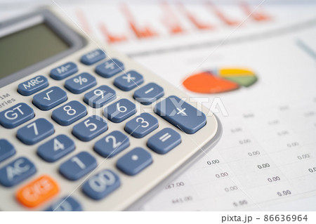 Calculator on graph paper. Finance development, Banking Account, Statistics, Investment Analytic research data economy, Stock exchange trading, Business company concept. Calculator on graph paper. Finance development, Banking Account, Statistics, Investment Analytic research data economy, Stock exchange trading, Business company concept. 86636964