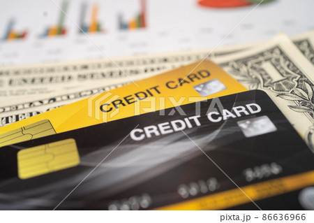 Credit card with US dollar banknote on chart and graph paper. Finance development, Banking Account, Statistics, Investment economy business. Credit card with US dollar banknote on chart and graph paper. Finance development, Banking Account, Statistics, Investment economy business. 86636966
