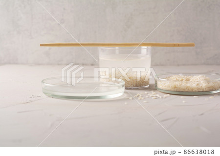 Jar of rice water for skin care face cleansing cosmetic product. Holistic beauty concept, fermented beauty care trend Jar of rice water for skin care face cleansing cosmetic product. Holistic beauty concept, fermented beauty care trend 86638018
