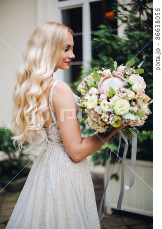 Bride in perfect wedding dress posing against Bride in perfect wedding dress posing against 86638056