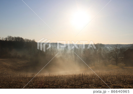 Winter morning, fog, sun and the sky over the frozen countryside near Zagreb, Croatia 86640965