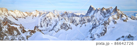 The mountain Aiguille du Midi 3842 meters in the Mont Blanc massif in the French Alps at sunset, panoramic image, peaks of mountains The mountain Aiguille du Midi 3842 meters in the Mont Blanc massif in the French Alps at sunset, panoramic image, peaks of mountains 86642726