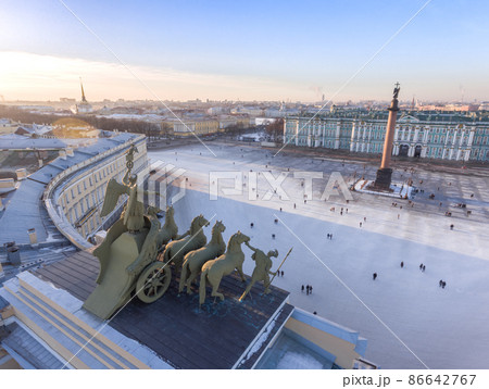 Aerial cityscape of Palace Square through a Triumphal chariot, rear view, winged Nick, a symbol of military glory, over arch of the General Staff Building, Aleksandr column, Winter Palace, Admiralty 86642767