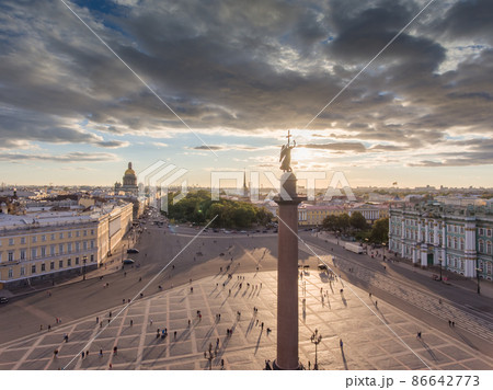 erial view of Palace Square and Alexandr Column at sunset, a gold dome of St. Isaac's Cathedral, golden spire of Admiralty building, the Winter Palace, long shadows, cloud 86642773