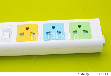 Electrical power strip on green background. Electrical power strip on green background. 86643311