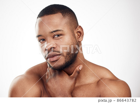 Be the best-looking, most well-groomed man in the room. Studio portrait of a handsome young man posing against a white background. 86643782