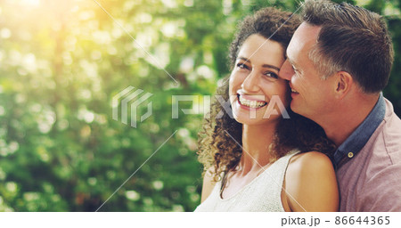 Hes the reason behind my smile. Shot of a happy and affectionate mature couple spending quality time together outdoors. Hes the reason behind my smile. Shot of a happy and affectionate mature couple spending quality time together outdoors. 86644365