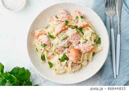 Salmon pasta, tagliatelle with fish and creamy sauce. Italian dinner with seafood 86644835