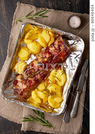 Spicy barbecue pork ribs and crushed smashed potatoes. Slow cooking recipe. Spicy barbecue pork ribs and crushed smashed potatoes. Slow cooking recipe. 86646404