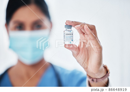 Were armed and ready to fight this virus. Shot of a medical practitioner holding a vial with COVID-19 on it. Were armed and ready to fight this virus. Shot of a medical practitioner holding a vial with COVID-19 on it. 86648919