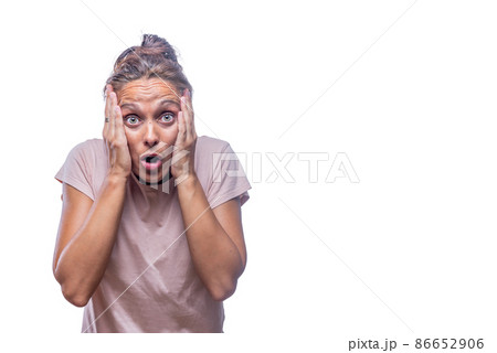 surprised adult woman with hands on face looking at camera surprised adult woman with hands on face looking at camera 86652906