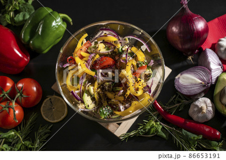Freshly Made Vegetable Salad in the Bowl Surrounded Natural Organic Veggies. Healthy Food Concept Freshly Made Vegetable Salad in the Bowl Surrounded Natural Organic Veggies. Healthy Food Concept 86653191