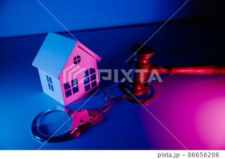 Gavel and handcuffs with house. Concept fraud with real estate. Crime and Punishment concept 86656206