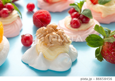 Pavlova meringue cake with walnut  blue background 86658456