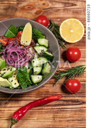 salad mix with avocado and cucumber, with balsamic dressing salad mix with avocado and cucumber, with balsamic dressing 86660719