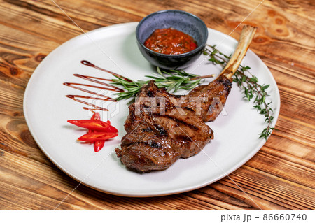 BBQ Lamb rack with tomato 86660740