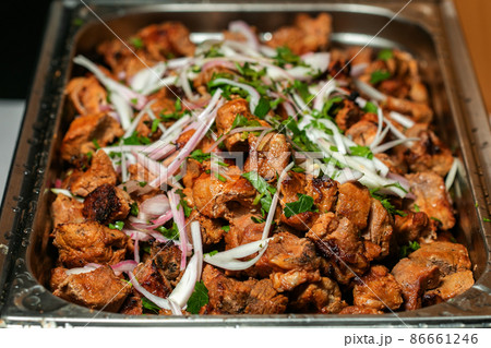 Fried grilled pork chops with caramelized onions Fried grilled pork chops with caramelized onions 86661246