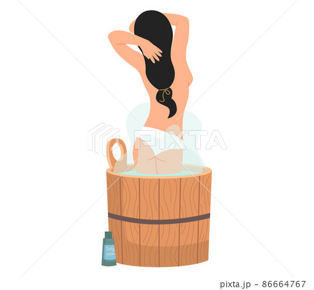 Lady standing in wooden tub with hot water. Home bathhose, spa procedures in wooden water barrel 86664767