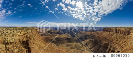 View over San Juan river canyon in Utah from Muley Point near Monument Valley with spectacular cloud formation 86665059
