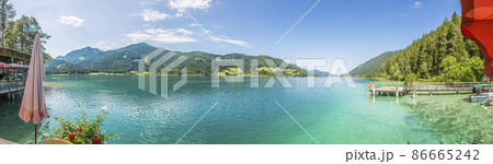 Panoramic view over lake Weissensee in Austria in summer during daytime Panoramic view over lake Weissensee in Austria in summer during daytime 86665242
