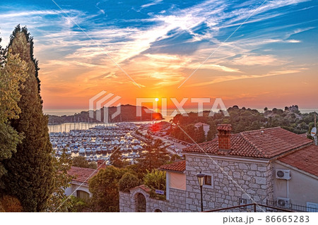 Panorama over the harbor of the Croatian coastal town Vrsar taken from the old town during the sunset 86665283