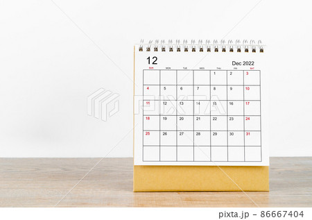December 2022 desk calendar on wooden background. December 2022 desk calendar on wooden background. 86667404