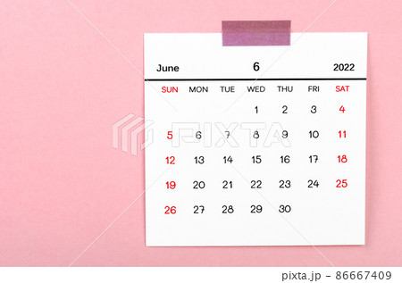 June 2022 calendar on pink background. 86667409